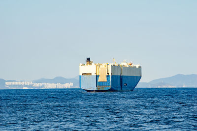 Nautical vessel on sea against clear sky