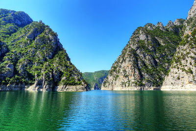 Scenic view of sea against clear blue sky