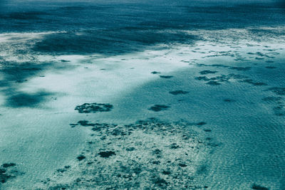 High angle view of footprints on beach