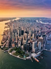 High angle view of city buildings during sunset