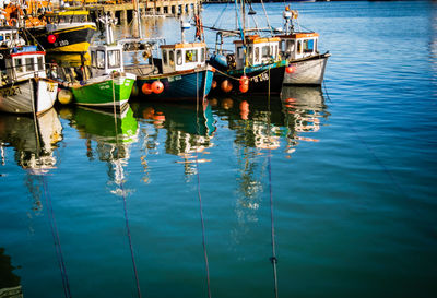 Boats moored on sea