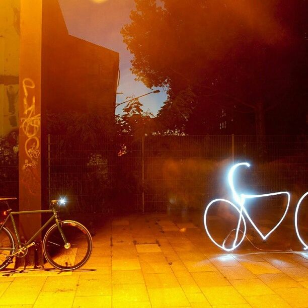 VIEW OF ILLUMINATED LIGHTS AT NIGHT