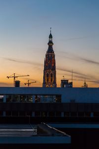 Clock tower against sky in city