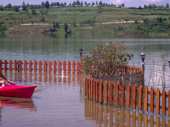 Wooden posts in lake