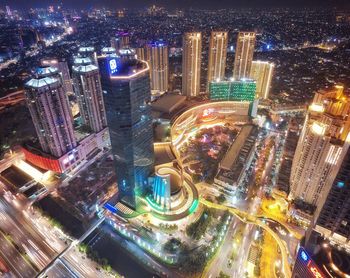 High angle view of illuminated city buildings at night