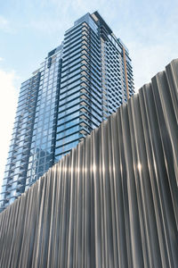 Low angle view of modern buildings against sky