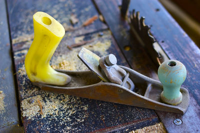 Old metal plane on the machine of a woodworking sawmill