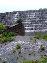 Blurred motion of wall by rocks against the sky