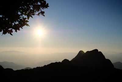 Scenic view of silhouette mountains against sky during sunset