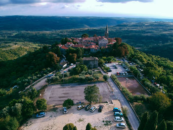 High angle view of buildings and trees in city