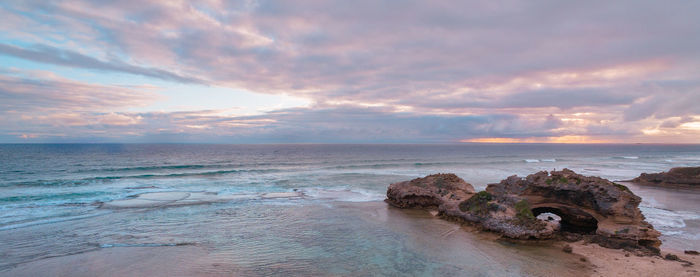 Scenic view of sea against cloudy sky
