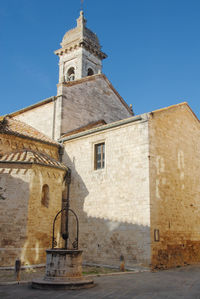 View of old building against clear blue sky