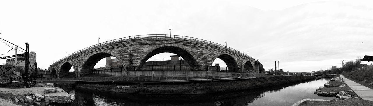 bridge - man made structure, arch, architecture, day, built structure, water, transportation, outdoors, sky, no people, nautical vessel, nature