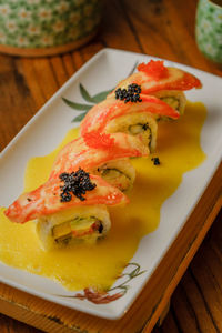 High angle view of fish in plate on table
