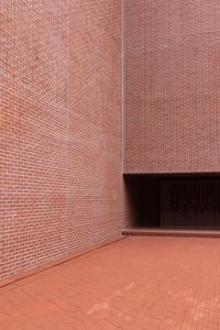 Sunlight falling on tiled floor against wall