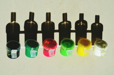 Multi colored bottles on shelf