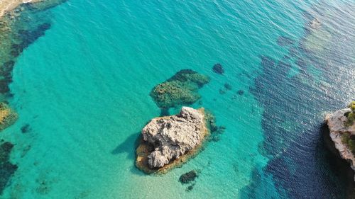 High angle view of rock formation in sea