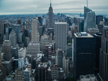 High angle view of modern buildings in city against sky