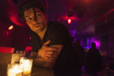 Young man enjoying a drink at a bar