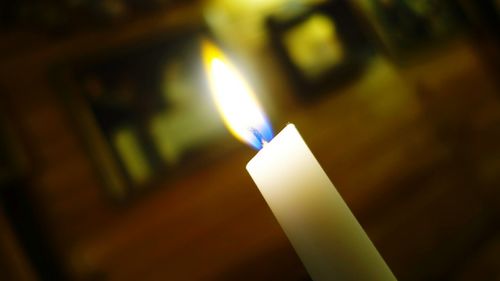 Close-up of lit candle