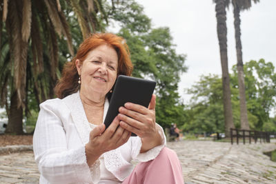 Young woman using mobile phone