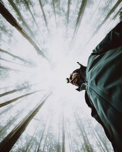 Low angle view of woman against sky