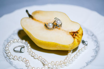 Close-up of wedding rings on table