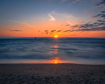 Scenic view of sea against sky during sunrise 