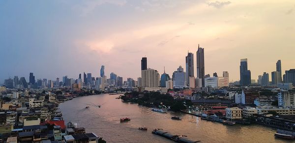 Panoramic view of buildings against sky during sunset