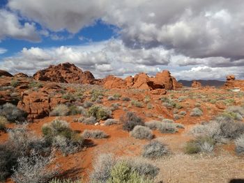 Scenic view of mountains against cloudy sky