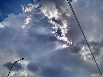 Low angle view of cables against sky