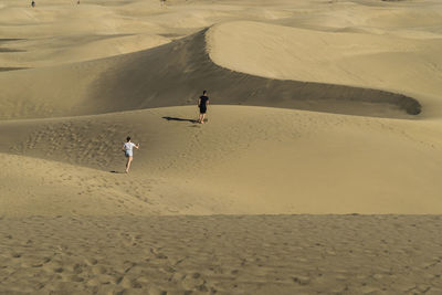 People walking on desert