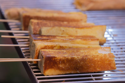 Close-up of bread on barbecue grill