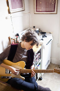 Young woman playing a guitar