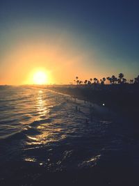 Scenic view of beach against sky during sunset