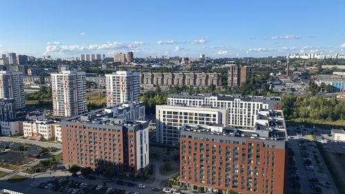 High angle view of buildings in city against sky