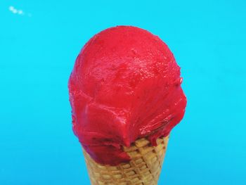 Close-up of red flower over black background