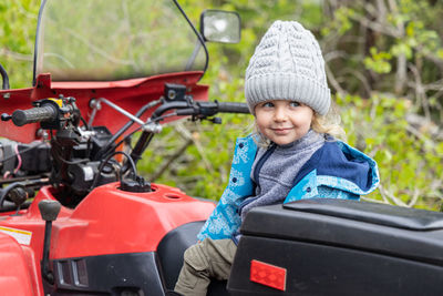 Full length of boy riding motorcycle