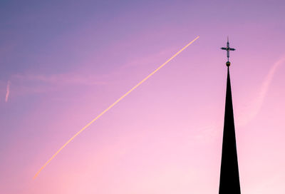 Low angle view of vapor trails in sky