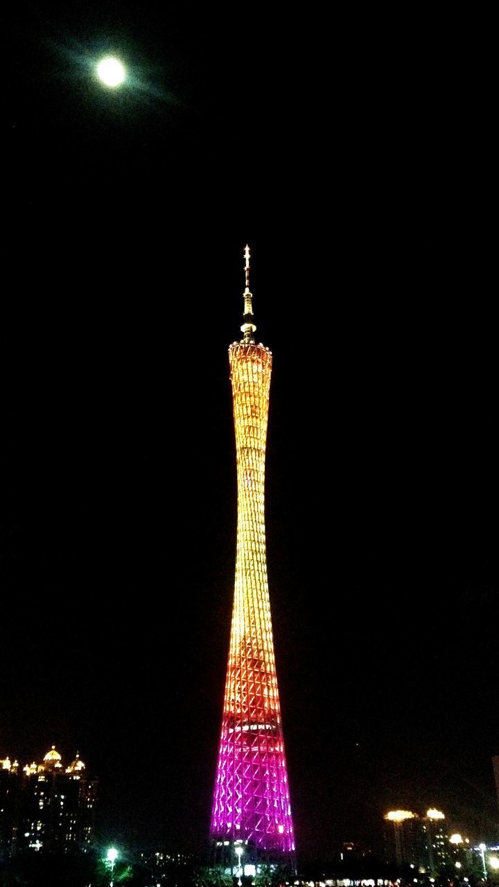 illuminated, night, international landmark, famous place, travel destinations, tourism, tower, capital cities, tall - high, architecture, built structure, travel, low angle view, city, communications tower, building exterior, eiffel tower, clear sky, sky, spire