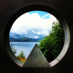 Scenic view of mountain against cloudy sky