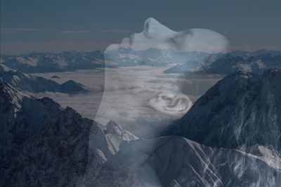 Double exposure image of woman and rock formation