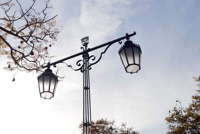 Low angle view of street light against sky