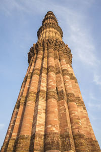 The minaret of qutub minar, in delhi, india. constructed with red sandstone and marble.