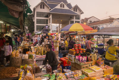 People at market stall