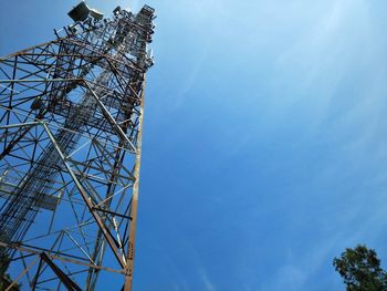 Low angle view of communications tower against sky