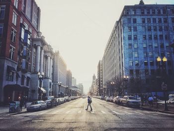 People walking on road in city