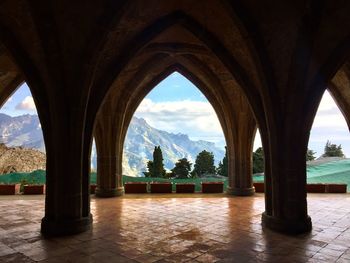 View of arched structure against cloudy sky