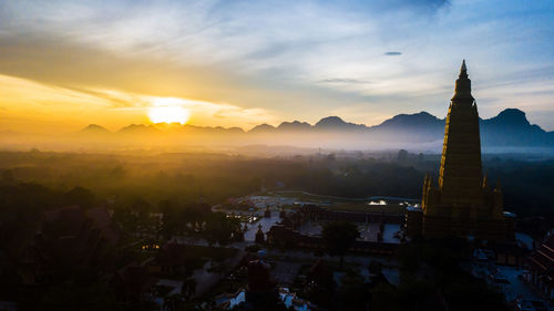 Panoramic view of buildings against sky during sunset