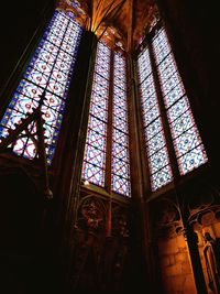 Low angle view of glass window in temple